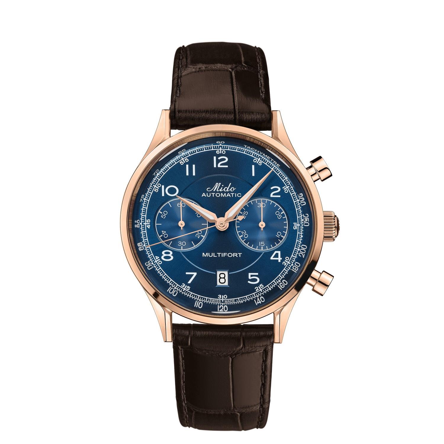 Die MULTIFORT PATRIMONY CHRONOGRAPH ist eine luxuriöse Armbanduhr mit blauem Zifferblatt, roségoldenem Gehäuse, zwei Hilfszifferblättern und braunem Lederarmband. Auf dem Zifferblatt sind "Mido Automatic" und "Multifort" angegeben.