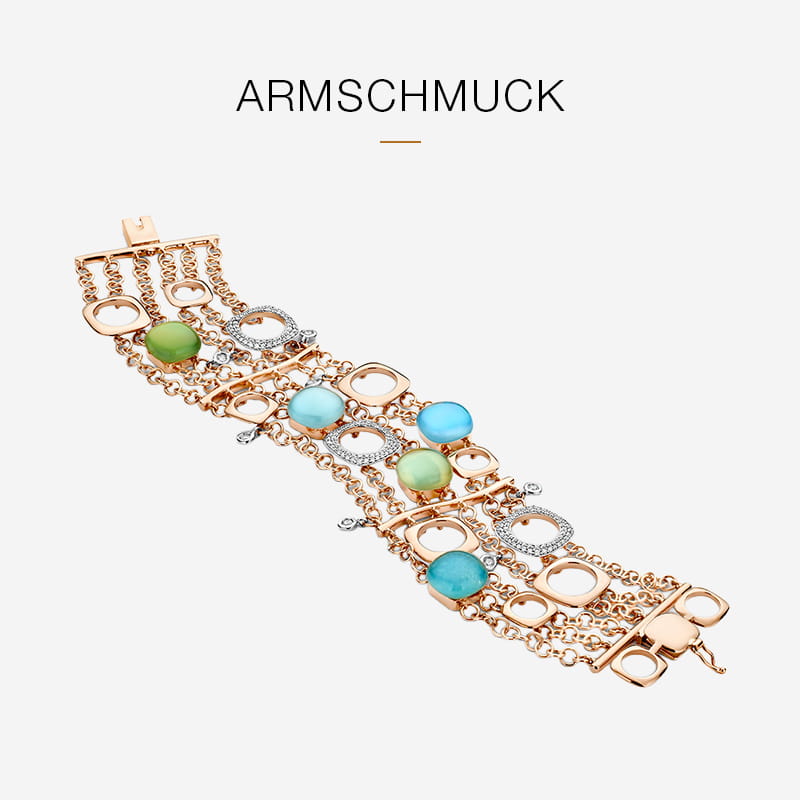 Ein breites Goldarmband von Bigli mit mehreren Ketten, runden Gliedern und blauen und grünen Schmucksteinen. Auf weißem Hintergrund mit dem Wort "ARMSCHMUCK" darüber.