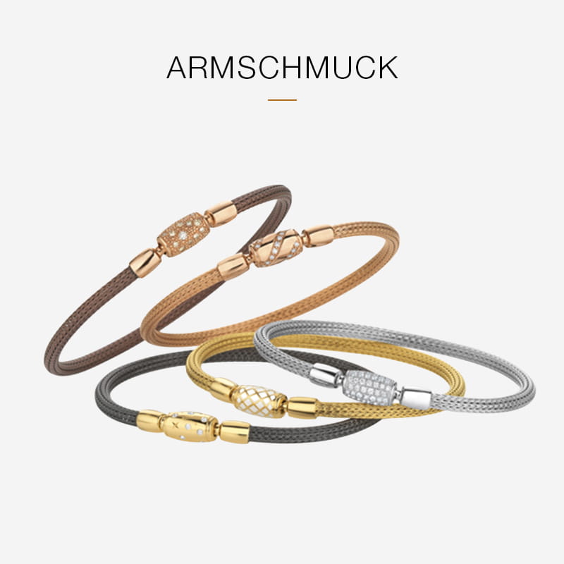 Fünf elegante Jörg Heinz Maschenarmbänder in Braun-, Gold- und Silbertönen mit dekorativen Verschlüssen auf weißem Grund. Über den Armbändern steht das Wort "ARMSCHMUCK".